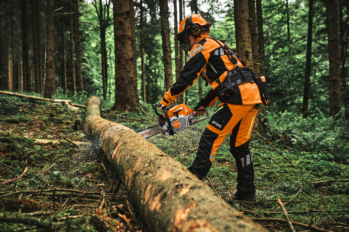 STIHL MS 300 C-M petrol chainsaw cutting timber in a forest